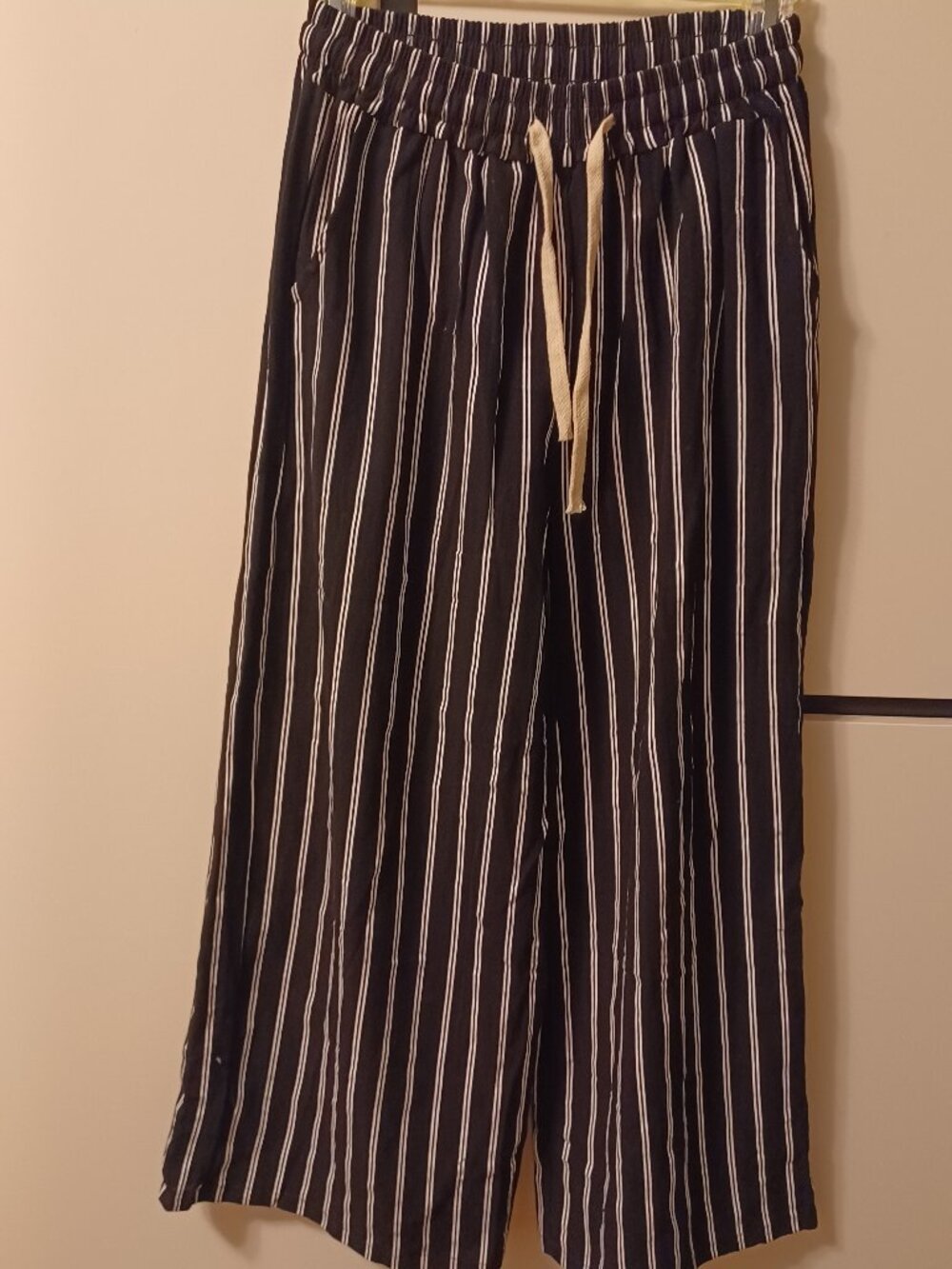 Black pants with white stripes, size M